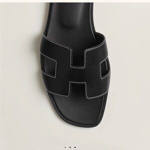 Authentic Hermes  Black Oran Sandals
Comes w/ Box, dust bags and receipt